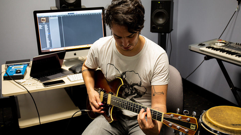 A student recording in the Electronic Music Studios (EMS)
