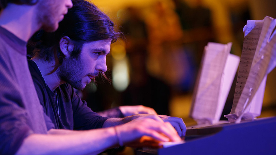 Students practicing a live performance in the Great Hall